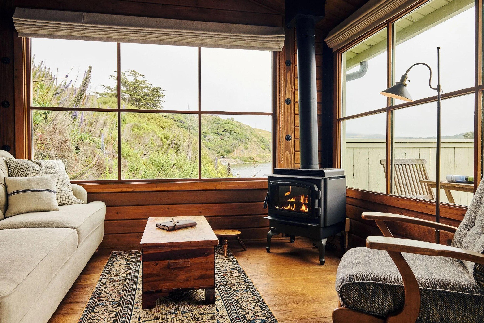 Warm wood-burning fireplace in a cozy living room